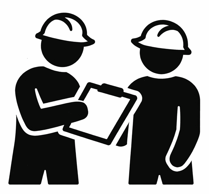 Two construction workers reviewing a clipboard together.